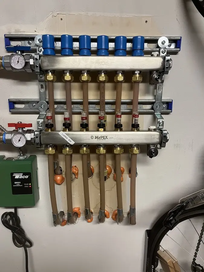 Plumber performing Water Heater Repair at a residential property in Marshfield